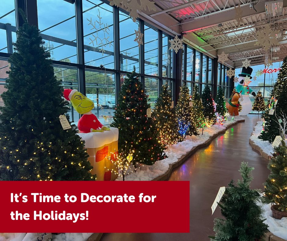 Holiday trees and inflatables with snowflake decor in the atrium